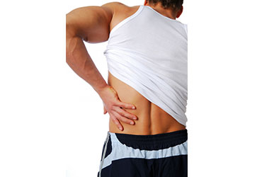 man holding his lower back from pain
