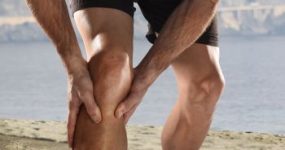 Man Grabbing His Knee in Pain