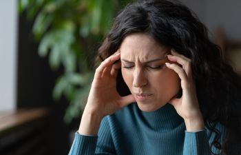 A woman sufferring from tension headache.